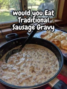 Bowl of traditional sausage gravy served over biscuits.