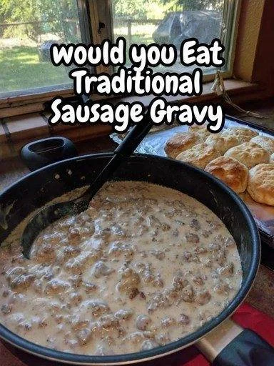 Bowl of traditional sausage gravy served over biscuits.