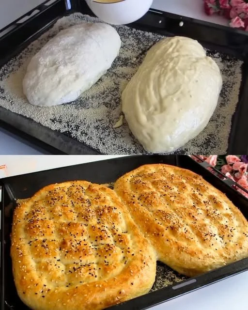 Freshly baked traditional Turkish bread on a wooden table.