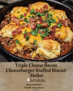 Triple Cheese Bacon Cheeseburger Stuffed Biscuit Skillet served in a cast iron pan