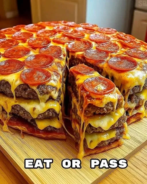 Delicious ultimate double cheeseburger pizza stack topped with cheese and patties