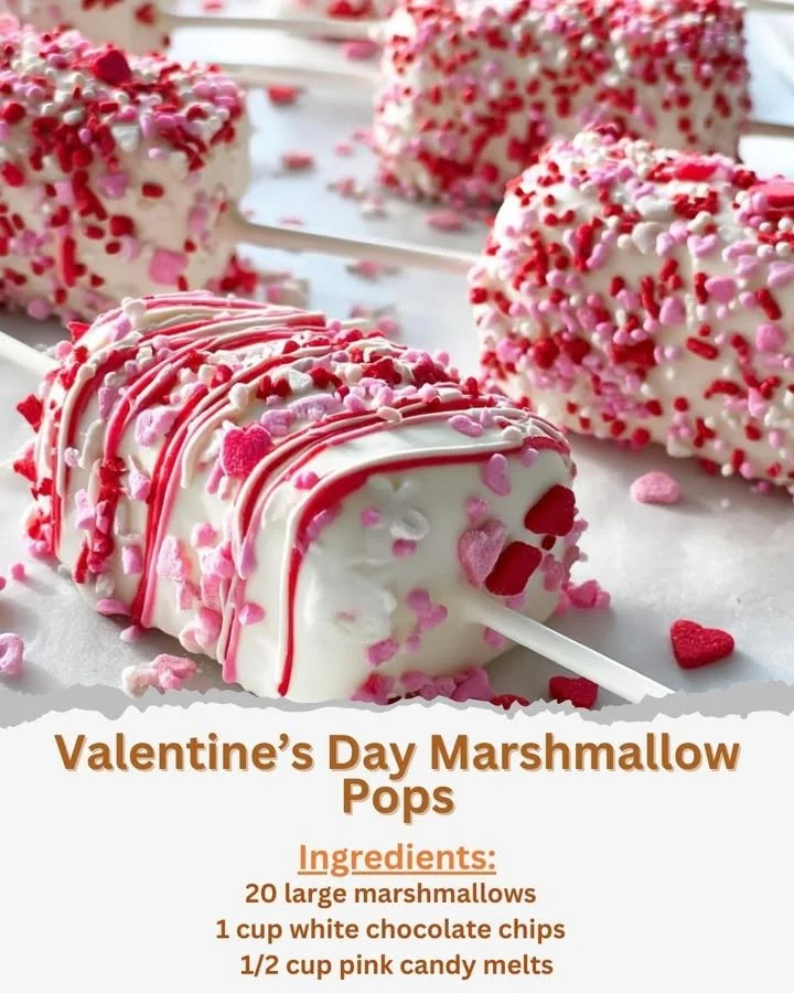 Decorated Valentine's Day Marshmallow Pops on a festive display