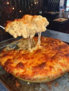 Creamy Vegan Baked Mac and Cheese in a ceramic dish topped with breadcrumbs