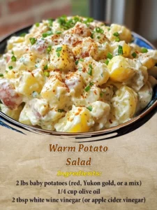 Warm potato salad with herbs and spices served in a rustic bowl