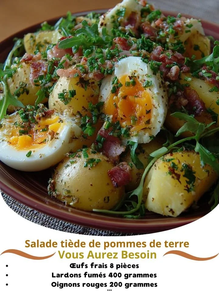 Warm potato salad with soft boiled eggs and crispy bacon on a serving dish.
