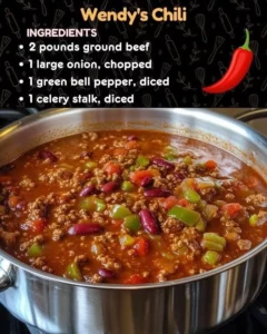 Bowl of Wendy's Chili with beans and beef on a wooden table