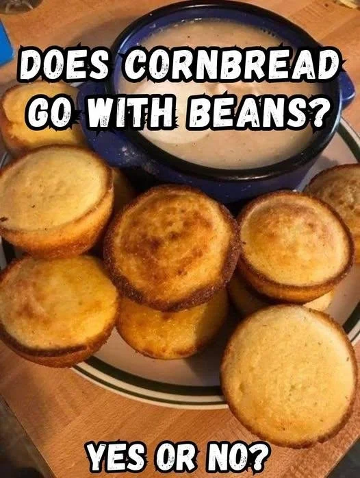 Delicious plate of beans and cornbread on a rustic table