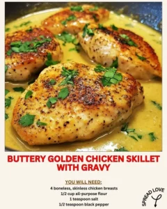 Buttery golden chicken skillet with gravy served in a rustic dish