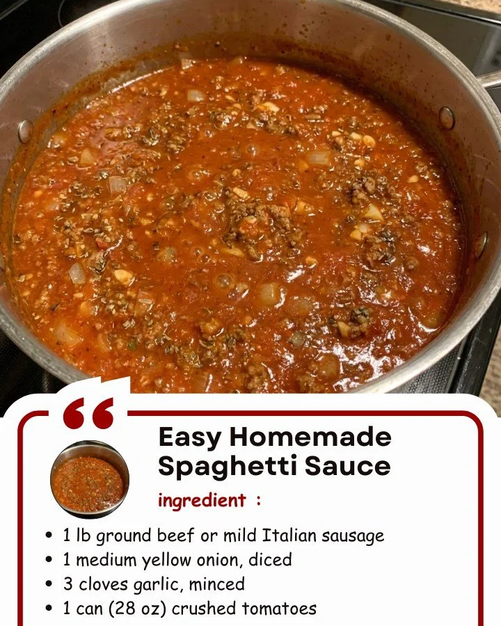 Homemade spaghetti sauce simmering in a pot with fresh ingredients.