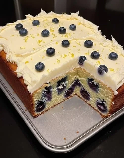 Delicious Lemon Blueberry Cream Cheese Pound Cake on a rustic table