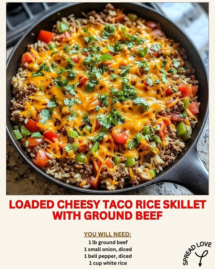 Loaded Cheesy Taco Rice Skillet topped with ground beef and melted cheese