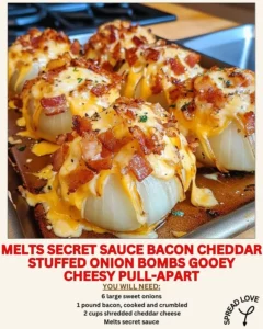 Bacon Cheddar Stuffed Onion Bombs on a grill with secret sauce