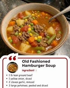Bowl of old fashioned hamburger soup filled with vegetables and ground beef