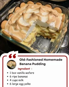 Homemade banana pudding served in a glass dish, topped with whipped cream and banana slices.