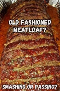 Delicious slice of old-fashioned meatloaf on a plate with garnish