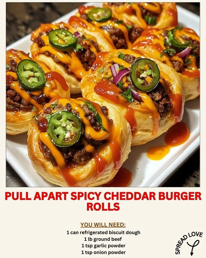 Pull apart spicy cheddar burger rolls served on a platter with dipping sauce