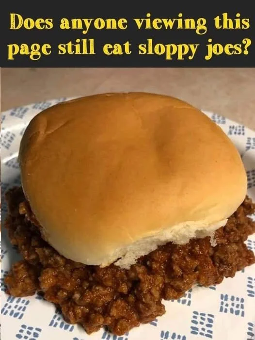 Delicious homemade sloppy joes served on a bun with toppings.