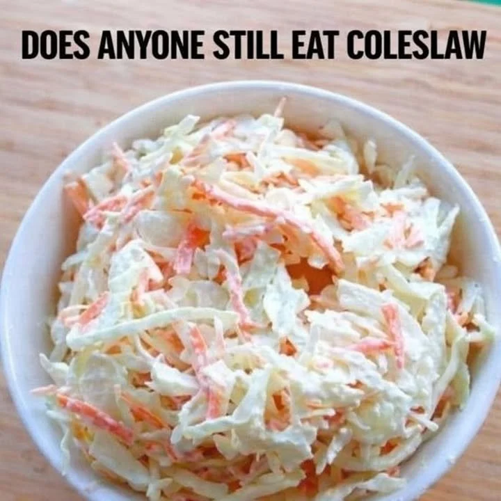 Delicious KFC coleslaw served in a bowl, featuring creamy dressing and crunchy cabbage.