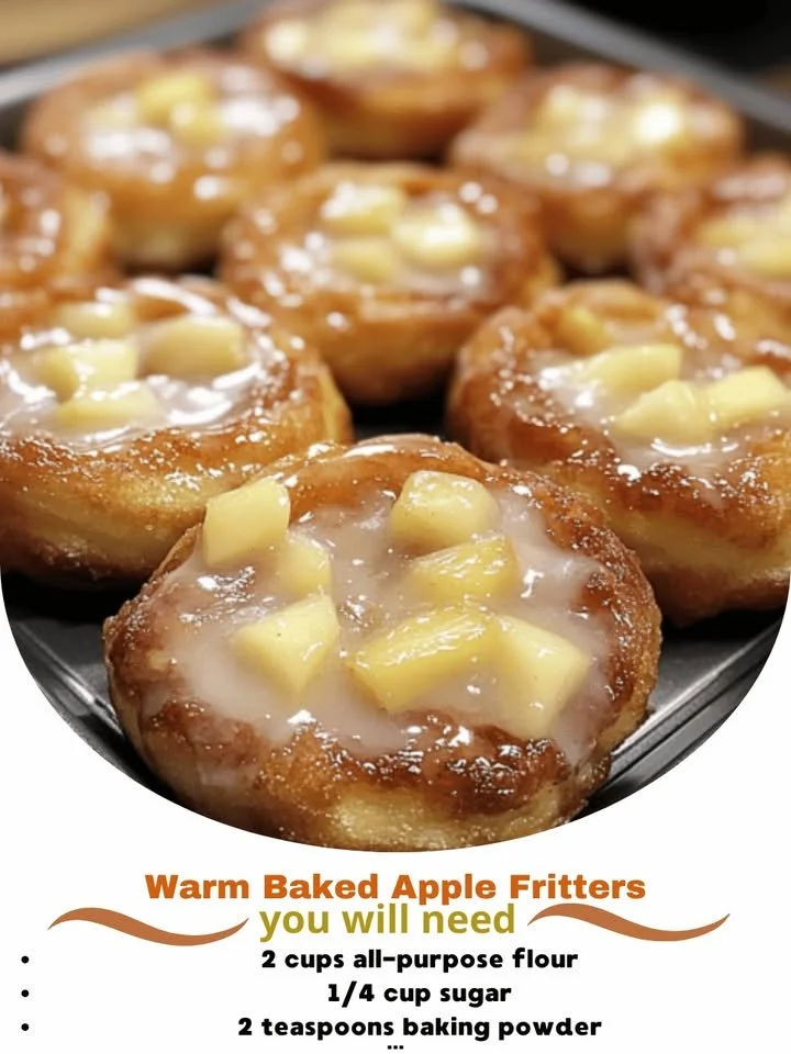 Warm baked apple fritters sprinkled with cinnamon and sugar, served warm
