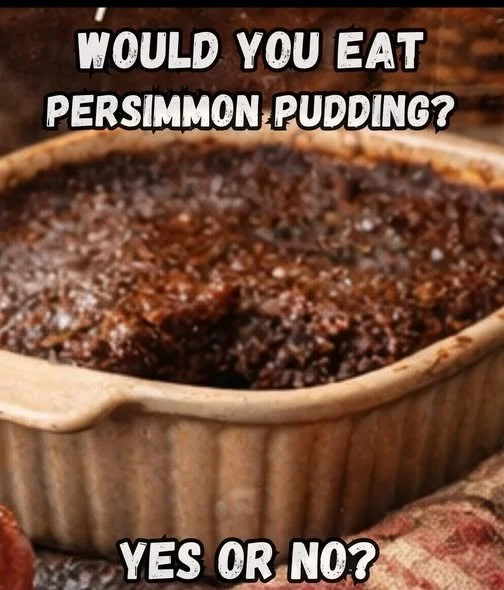 Delicious warm persimmon pudding served with cream on a rustic plate.
